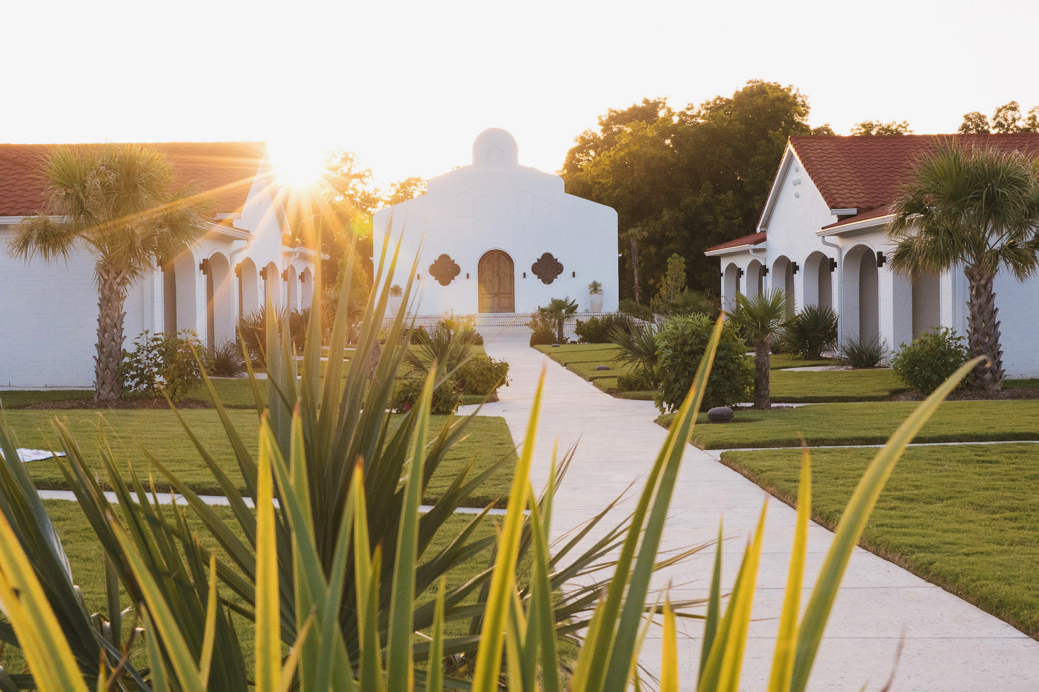 Casa Del Rey Chapel at sunset down the courtyard walk