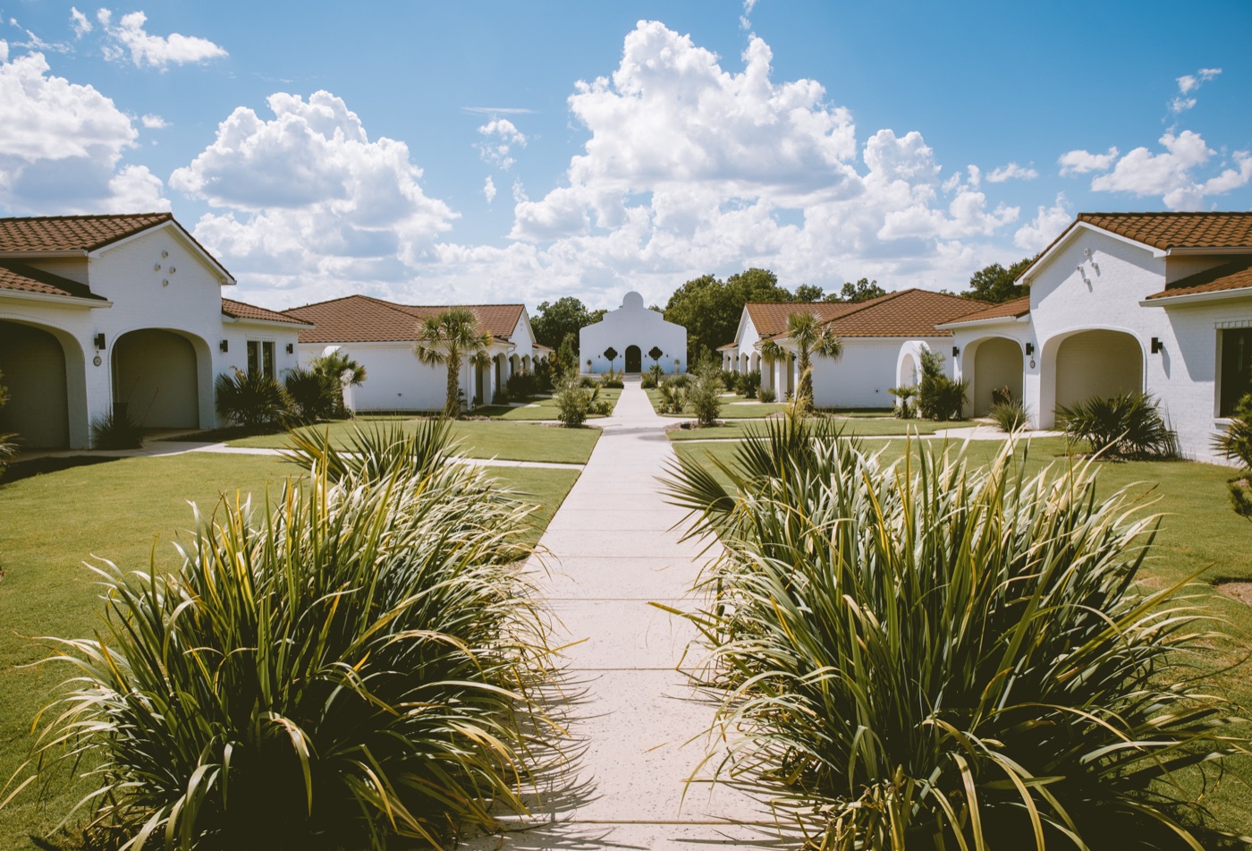 Courtyard path to Casa Del Rey Chapel between the casitas at La Palmilla Texas Hotel in Glen Rose